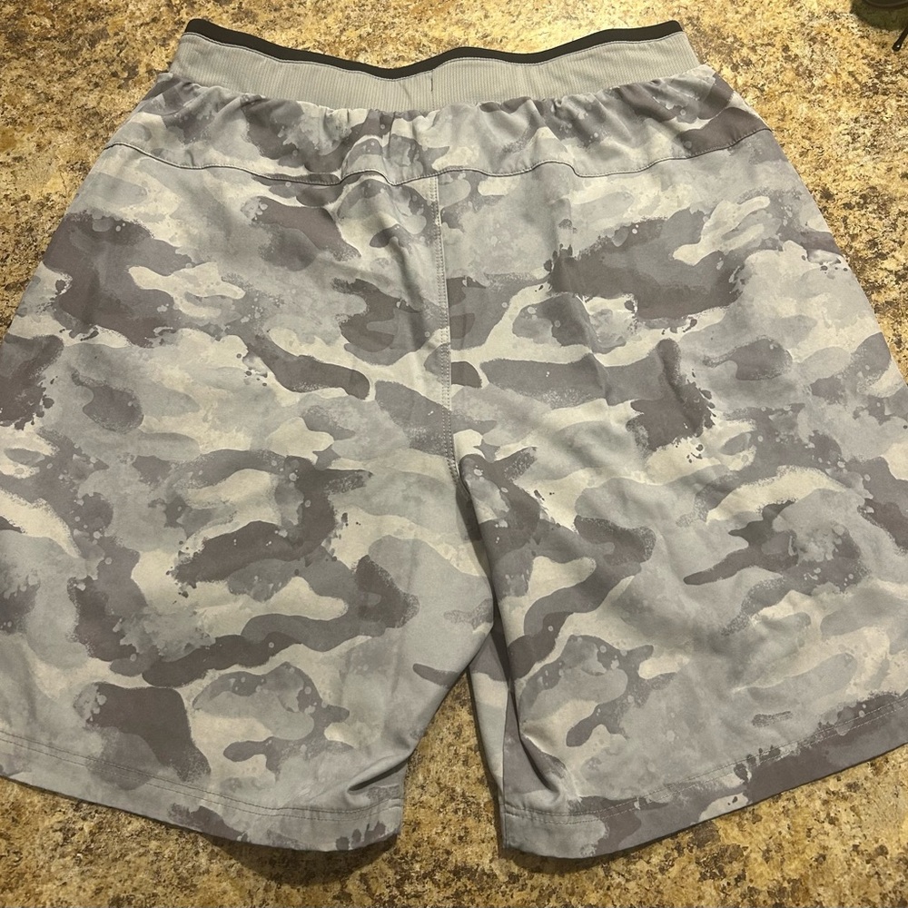 Grey camo Fabletics gym shorts.